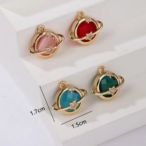 Set of four colorful planet-shaped metal pendants with sparkling gemstone centers
