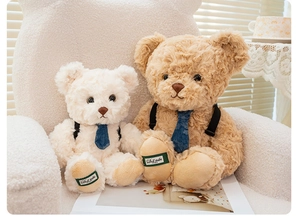 Detailed close-up of fluffy teddy bears in beige and brown with chic bow ties