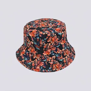 Detail of floral bucket hat featuring vibrant orange and blue prints on dark fabric