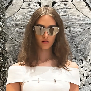 Futuristic silver cat-eye frameless sunglasses for women with a trendy cyber look