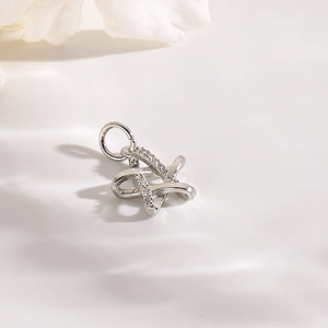 Macro view of a silver hollow star pendant with sparkling pavé cubic zirconia details