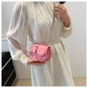 Detailed view of the pink faux leather shoulder bag with a stylish silver chain strap