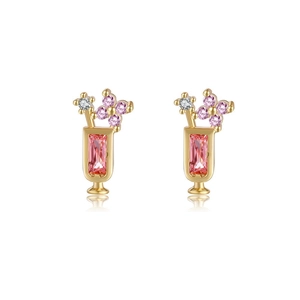Macro shot of champagne glass stud earrings featuring pink crystals and 18K gold plating