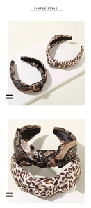 Detail of twisted leopard and snake print headbands with premium satin texture