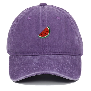 Close-up of watermelon embroidery on washed purple cotton baseball cap fabric texture