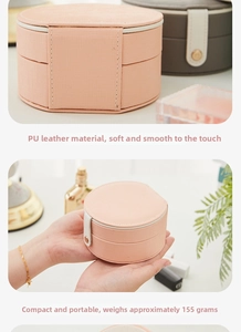 Detail of pink PU leather jewelry box showing texture and compact 155g lightweight size
