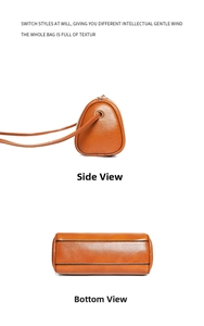 Close-up detail view of brown leather cylinder shoulder bag showing side and bottom view.