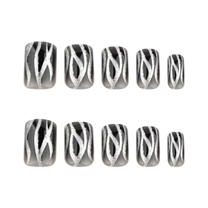 Short square-round press-on nails with black gradient and silver glitter flame patterns