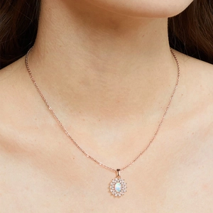 Rose gold sunflower necklace with oval opal pendant and zircon halo on female model