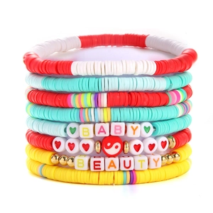 Stacked colorful clay heishi bead bracelets with BABY and BEAUTY letter charms