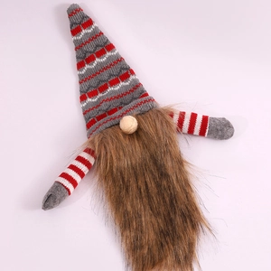 Close-up of Christmas gnome wine bottle cover with grey-red striped knit hat and plush beard