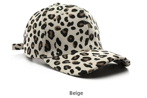 Detail view of beige corduroy baseball cap with leopard print and adjustable back strap