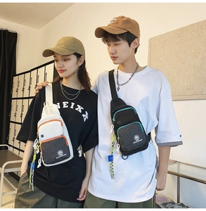 Detail of water-resistant street style chest bags in white and black with checkered patterns