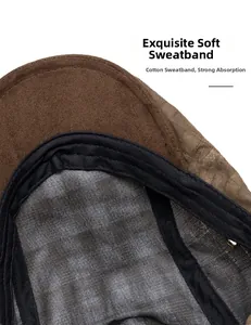 Detail view of cotton sweatband on plaid ivy cap showing soft texture and stitching