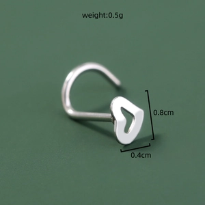Macro shot of silver heart nose ring with detailed dimensions 0.8cm x 0.4cm and 0.5g weight