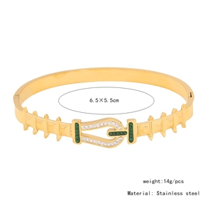 Detail of gold stainless steel bangle showing 6.5x5.5cm size and 14g weight