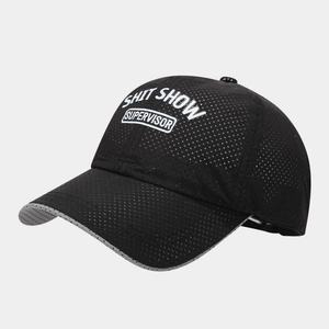 Close-up of black breathable mesh baseball cap featuring white Shit Show Supervisor print