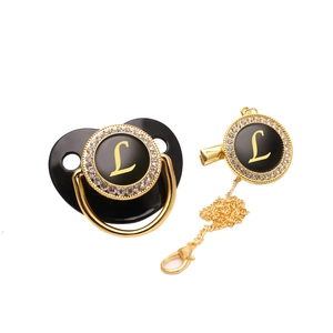 Ciuccio di lusso nero e oro con strass e clip per succhietto con l'iniziale L