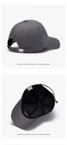 Detail of gray cotton baseball cap featuring silver metal buckle and 100% cotton inner lining