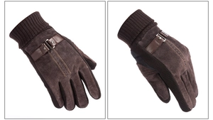Detail view of brown pigskin leather gloves with soft suede finish and wrist strap buckle