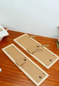 Wooden photo frame back view with metal clips, hanging hook, and foldable support stand