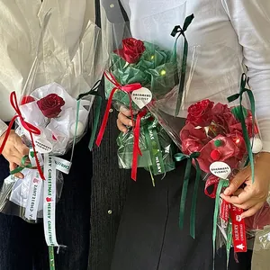 Single red rose Christmas gift box with LED lights and festive holiday packaging