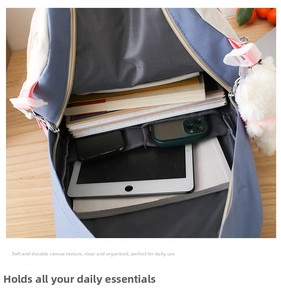 Detail showing the spacious interior compartments of the blue and white school backpack