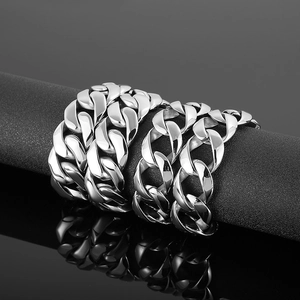Detail showing two widths of polished stainless steel Cuban link chains in silver finish