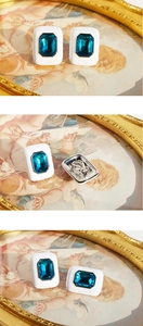 Detailed close-up showing blue zircon square earrings with white enamel and vintage design
