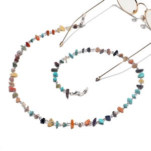 Detailed view of handmade colorful natural stone glasses chain with golden links