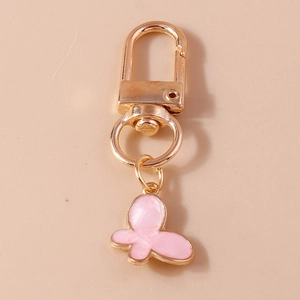 Pink butterfly and four-leaf clover keychain set with golden metal alloy finish