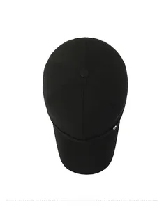 Close-up of black cotton baseball cap showing top view button and silver metal logo detail