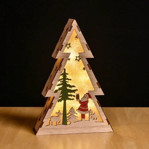 Detail of wooden Christmas tree LED light with laser-cut reindeer and Santa scene