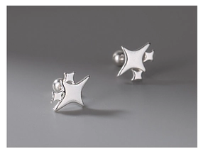 Macro detail of S999 sterling silver star stud earrings with screw back on grey background
