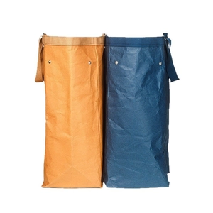 Washable kraft paper storage baskets with durable handles in yellow and navy blue