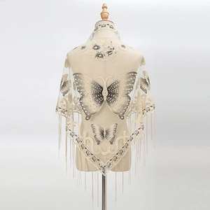 Beige lace triangle shawl featuring butterfly embroidery and long tassel detailing