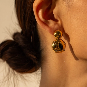 18k gold plated double sphere drop earrings with black gemstones and crystals on model