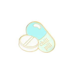 Cartoon enamel pill and capsule pin with Chill Pill text and gold metal plating