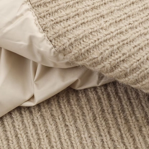 Beige thick knitted vest for women featuring warm padded fabric and cable knit texture