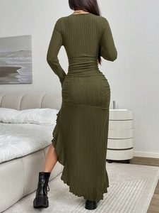 Detail of olive green ribbed knit dress featuring slim fit waist and irregular ruffle hem