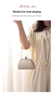 Detail of champagne glitter clutch with pearl edging and delicate silver chain strap