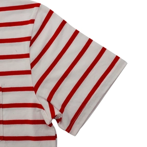 Close-up of red and white striped t-shirt showing stitching details and side pocket