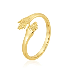 Close-up of golden hands hugging open ring with polished finish and elegant reflection