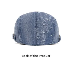 Rear view of distressed blue denim flat cap with adjustable side metal buckles