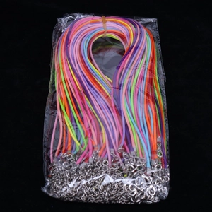 Macro detail of colorful suede cord necklace set with silver lobster clasps and extenders