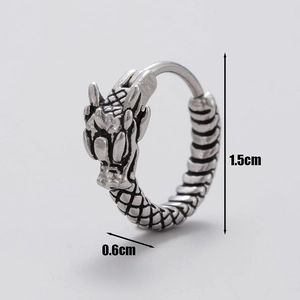 Detailed view of silver dragon head earring with dimensions 1.5cm by 0.6cm shown