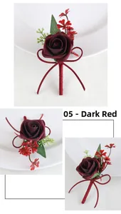 Detailed view of dark red artificial rose boutonniere with silk ribbon and green leaves