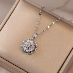 Elegant silver titanium steel necklace with a geometric floral zircon pendant in a gift box
