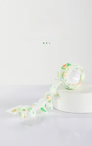 Detail of self-adhesive pet bandage showing green avocado pattern and breathable mesh texture