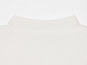 Close-up of the elegant high collar and fine knit fabric texture on white blazer jacket